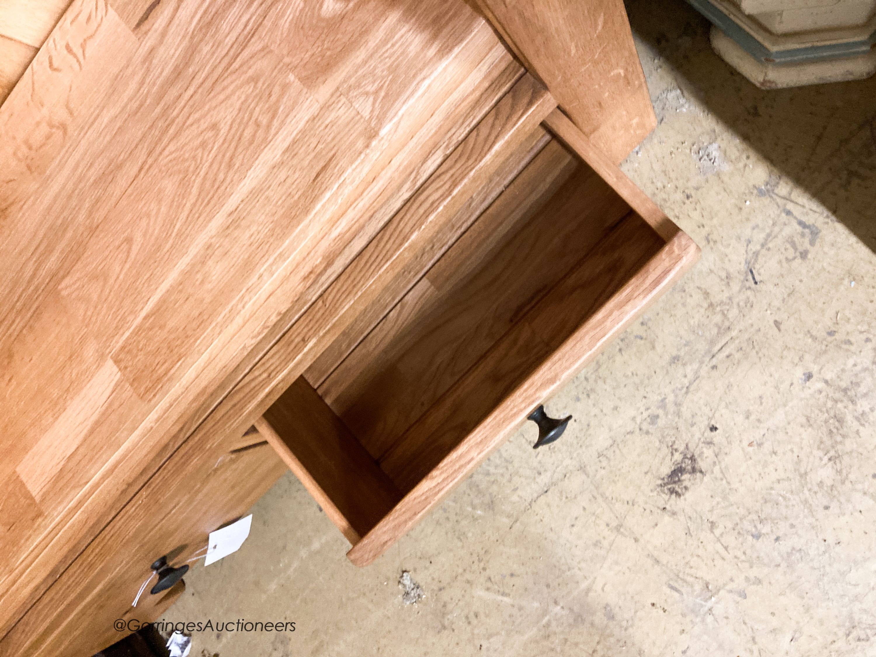 A contemporary light oak open bookcase, L.89cm D.27cm H.190cm